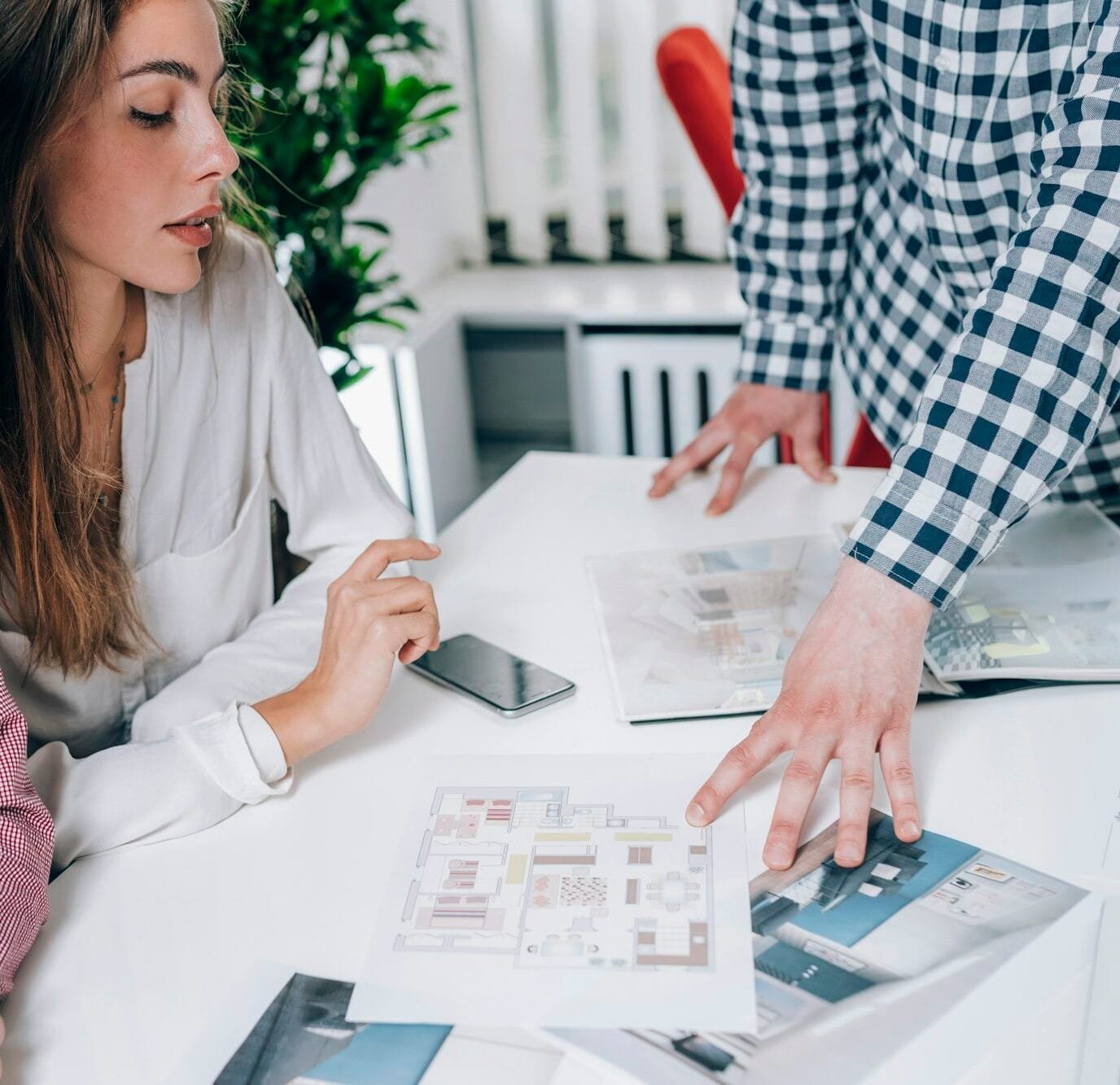 Couple in Real-Estate Agency Talking to Real Estate Agent